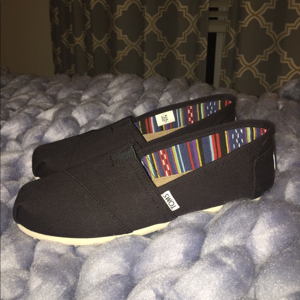 Brand new, never worn black Toms!